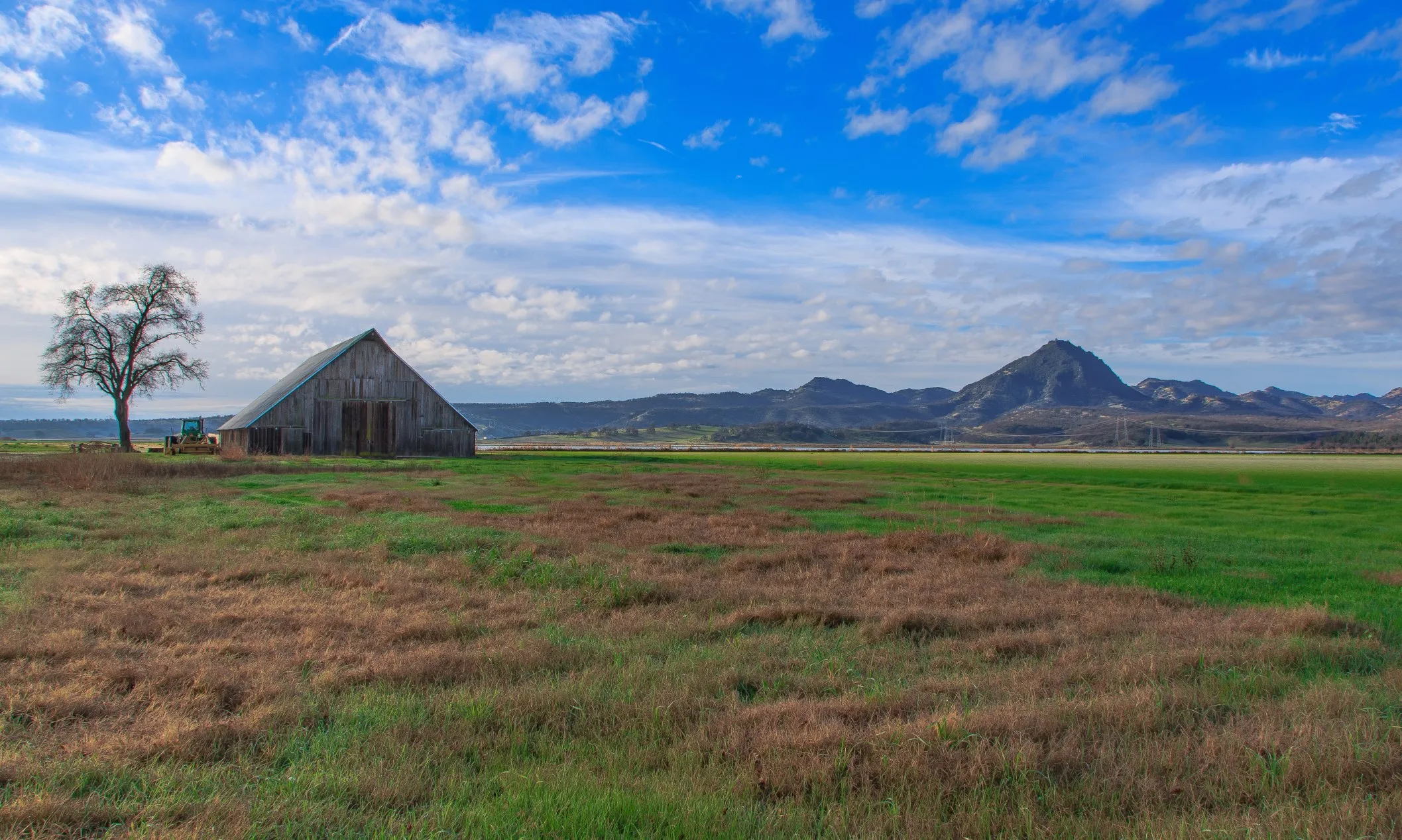 Barn with distance view of the Sutter buttes mountains